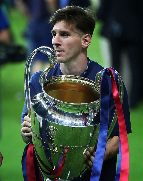 messi holding a trophy